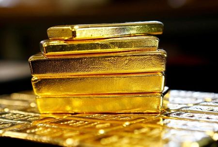 Gold prices trim some weekly gains on tempered rate cut
hopes
