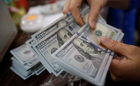 Dollar slips ahead of GDP data; euro rises and yen
surges