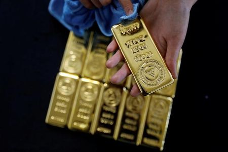 Gold prices edge up, remains pressured by strong dollar
after hawkish Fed