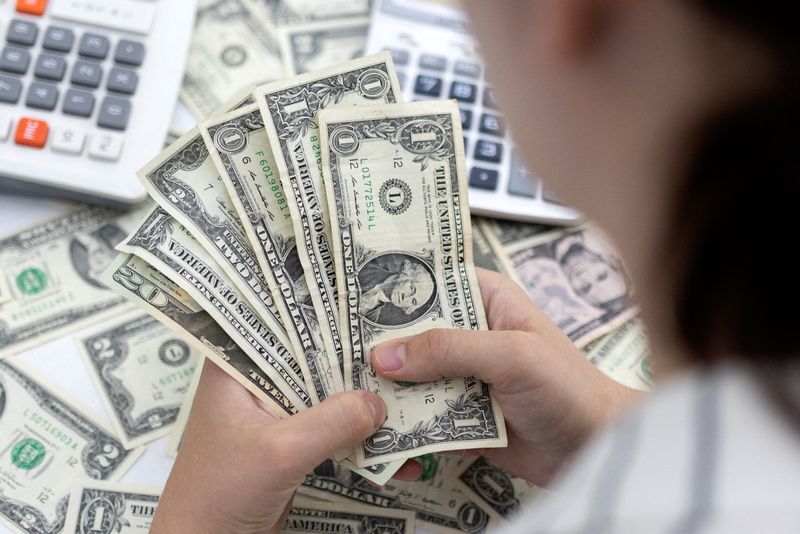 Dollar heads for weekly loss on dovish Fed
expectations